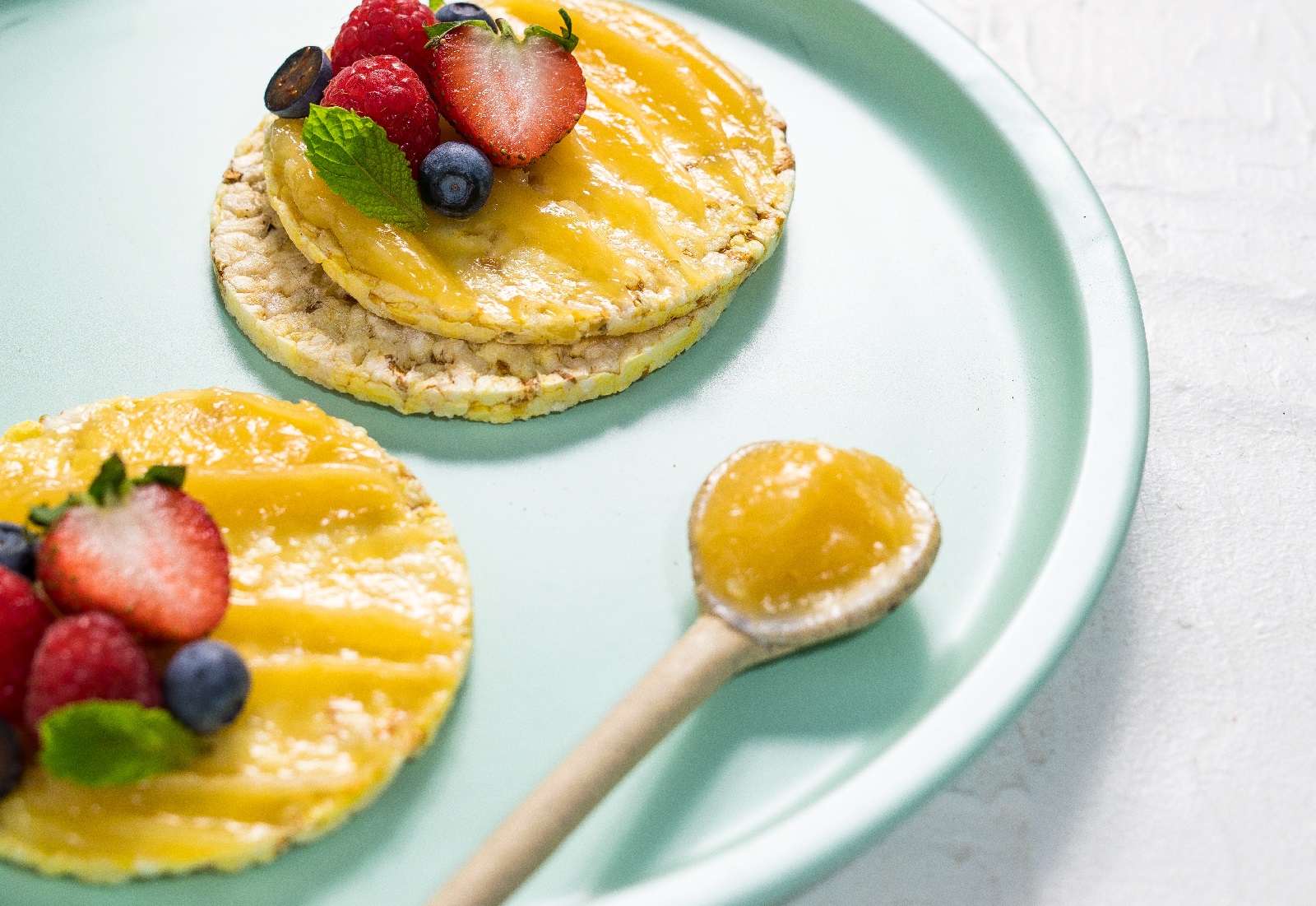 Lemon Curd, berries & mint on CORN THINS slices as a snack