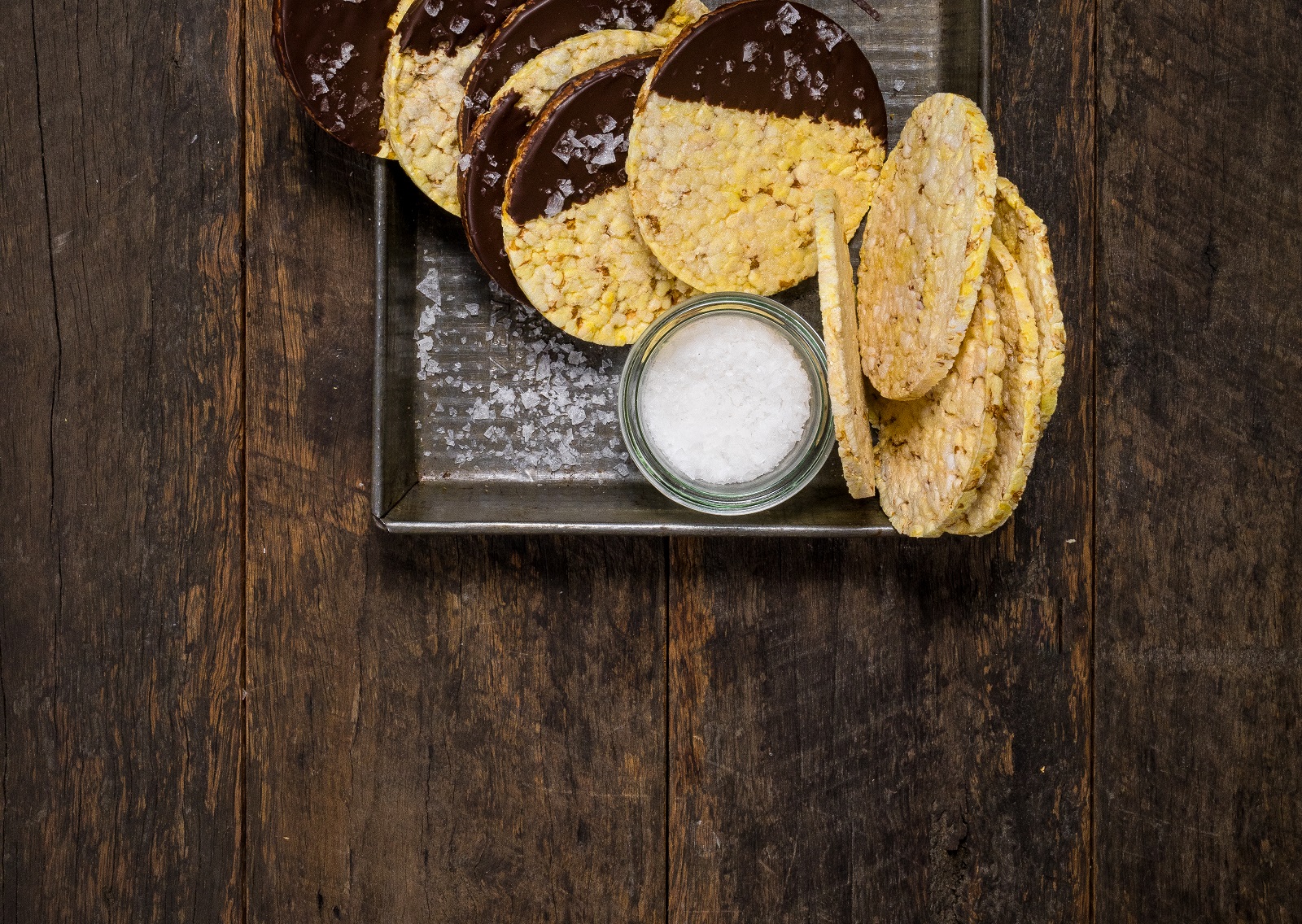 CORN THINS slices dipped in dark choclate with a sprinkle of sea salt
