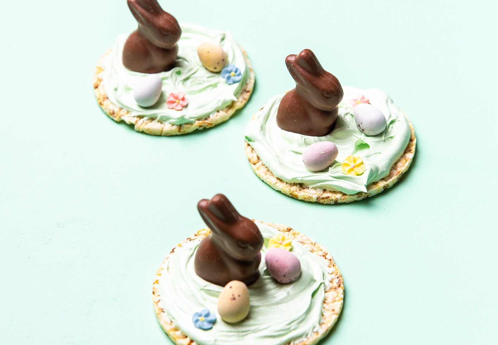 Special Easter treat using icing, choc bunnies & choc eggs on Corn Thins slices